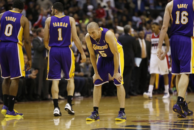 Nov 26, 2013; Washington, DC, USA; Los Angeles Lakers point guard Steve Blake (5) looks down after committing a turnover against the Washington Wizards in the fourth quarter at Verizon Center. The Wizards won 116-111. Mandatory Credit: Geoff Burke-USA TODAY Sports