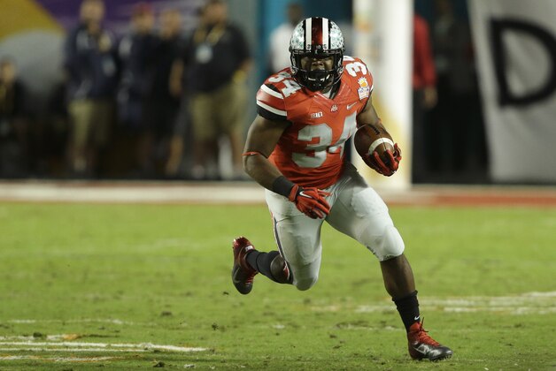 Ohio State running back Carlos Hyde (34) runs during the first half of the Orange Bowl NCAA college football game against Clemson, Friday, Jan. 3, 2014, in Miami Gardens, Fla. (AP Photo/Wilfredo Lee)