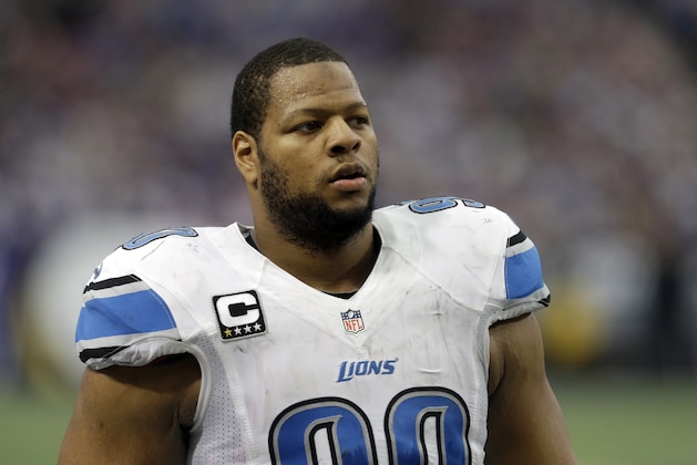 Detroit Lions defensive tackle Ndamukong Suh walks on the field during the first half of an NFL football game against the Minnesota Vikings, Sunday, Dec. 29, 2013, in Minneapolis. (AP Photo/Jim Mone)