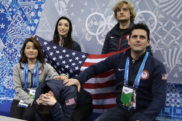 Jeremy Abbott of the United States, centre front, waits for his results after competing in the men's team short program figure skating competition at the Iceberg Skating Palace during the 2014 Winter Olympics, Thursday, Feb. 6, 2014, in Sochi, Russia. (AP Photo/Darron Cummings, Pool)