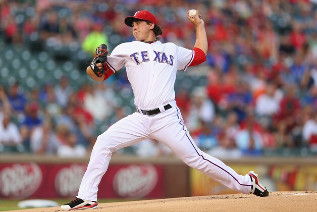 ARLINGTON, TX - SEPTEMBER 13:  Derek Holland #45 of the Texas Rangers throws against the Oakland Athletics in the first inning at Rangers Ballpark in Arlington on September 13, 2013 in Arlington, Texas.  (Photo by Ronald Martinez/Getty Images)