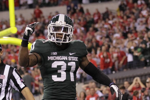 Michigan State's Darqueze Dennard (31) reacts during the second half of a Big Ten Conference championship NCAA college football game against Ohio State Saturday, Dec. 7, 2013, in Indianapolis. (AP Photo/AJ Mast)