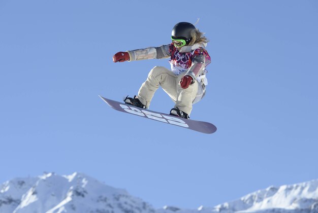 Feb 4, 2014; Krasnaya Polyana, RUS; USA snowboarder Jamie Anderson on the hill at the 2nd jump during a training session prior to the start of the Sochi 2014 Winter Olympic Games at Extreme Park. Mandatory Credit: Jack Gruber-USA TODAY Sports