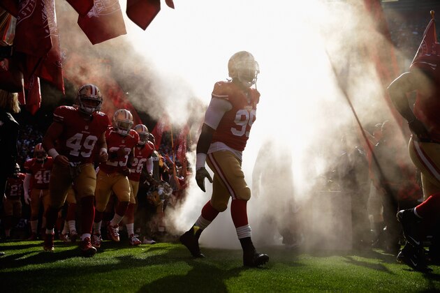 SAN FRANCISCO, CA - NOVEMBER 10:  Aldon Smith #99 of the San Francisco 49ers runs onto the field for their game against the Carolina Panthers at Candlestick Park on November 10, 2013 in San Francisco, California.  (Photo by Ezra Shaw/Getty Images)