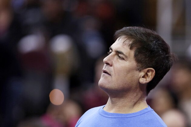 Dallas Mavericks owner Mark Cuban watches in the first quarter during an NBA basketball game against the Cleveland Cavaliers Monday, Jan. 20, 2014, in Cleveland. Dallas defeated Cleveland 102-97. (AP Photo/Tony Dejak)