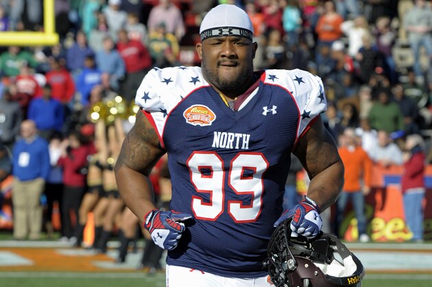 North defensive tackle Ra'Shede Hageman (99) of Minnesota runs on to the field before the Senior Bowl NCAA college football game on Saturday, Jan. 25, 2014, in Mobile, Ala. (AP Photo/G.M. Andrews)