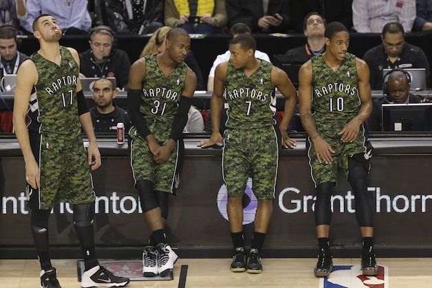 Jan 17, 2014; Toronto, Ontario, CAN; Toronto Raptors center Jonas Valanciunas (17) and guard Terrence Ross (31) and point guard Kyle Lowry (7) and guard DeMar DeRozan (10) wear their camo jerseys on Forces Night against the Minnesota Timberwolves at Air Canada Centre. Mandatory Credit: Tom Szczerbowski-USA TODAY Sports