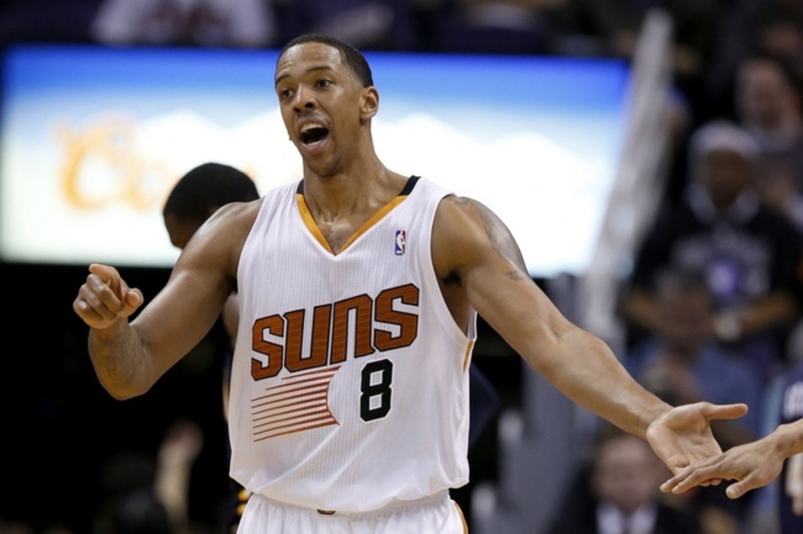 Phoenix Suns' Channing Frye gets a celebratory hand slap from at teammate after hitting a jump shot during the first half of an NBA basketball game against the Indiana Pacers Wednesday, Jan. 22, 2014, in Phoenix.  The Suns defeated the Pacers 124-100. (AP Photo/Ross D. Franklin)