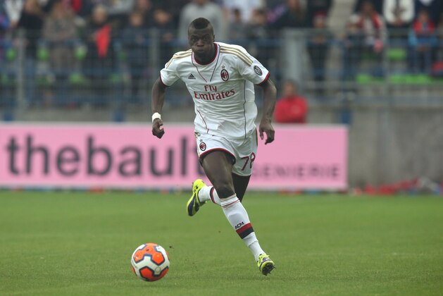 AC Milan's forward Mbaye Niang runs with the ball during his international friendly soccer match against Caen at the Michel d’Ornano stadium in Caen, western France, Sunday, Oct. 13, 2013. (AP Photo/David Vincent)