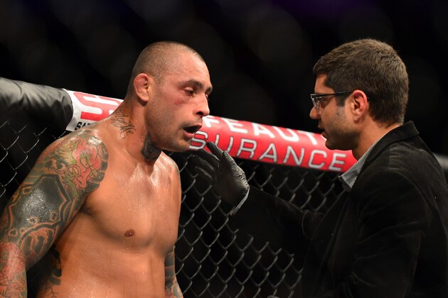 Oct 9, 2013; Barueri, Sao Paulo, Brazil; Thiago Silva (black shorts) is checked on during his fight against Matt Hamill (not pictured) during UFC Fight Night 29 at Jose Correa Arena. Mandatory Credit: Jason Silva-USA TODAY Sports