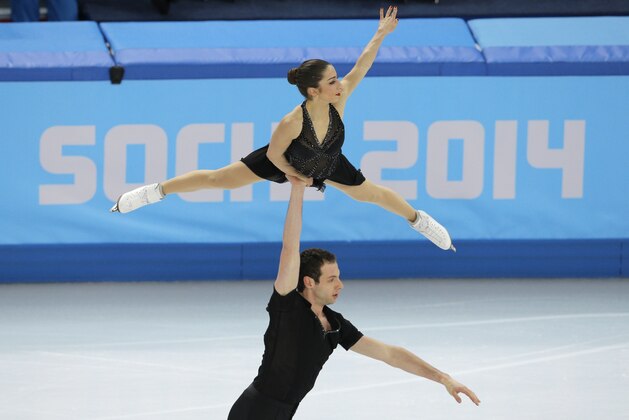 Marissa Castelli and Simon Shnapir of the United States compete in the team pairs short program figure skating competition at the Iceberg Skating Palace during the 2014 Winter Olympics, Thursday, Feb. 6, 2014, in Sochi, Russia. (AP Photo/Vadim Ghirda)