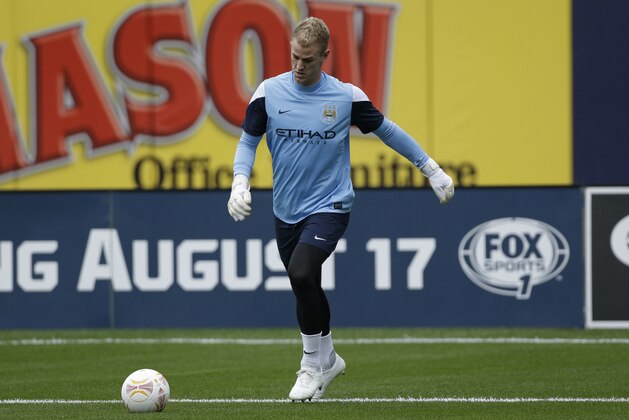 Manchester City goalkeeper Joe Hart warms up before an exhibition soccer match against Chelsea, Saturday, May 25, 2013, at Yankee Stadium in New York. (AP Photo/Julio Cortez)