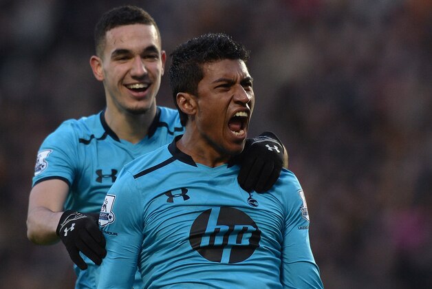 HULL, ENGLAND - FEBRUARY 01:  Paulinho of Tottenham Hotspur celebrates scoring a goal with team-mate Nabil Bentaleb during the Barclays Premier League match between Hull City and Tottenham Hotspur at KC Stadium on February 1, 2014 in Hull, England.  (Photo by Gareth Copley/Getty Images)