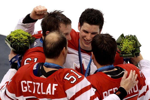 VANCOUVER, BC - FEBRUARY 28:  Sidney Crosby #87 of Canada celebrates with Patrice Bergeron #37, Rick Nash #61 and Ryan Getzlaf #51 after the ice hockey men's gold medal game between USA and Canada on day 17 of the Vancouver 2010 Winter Olympics at Canada Hockey Place on February 28, 2010 in Vancouver, Canada. Canada defeated USA 3-2 in overtime.  (Photo by Alex Livesey/Getty Images)
