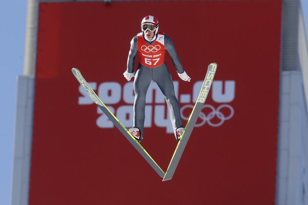 Austria's Gregor  Schlierenzauer makes an attempt during the men's normal hill ski jumping training at the 2014 Winter Olympics, Friday, Feb. 7, 2014, in Krasnaya Polyana, Russia. (AP Photo/Dmitry Lovetsky)