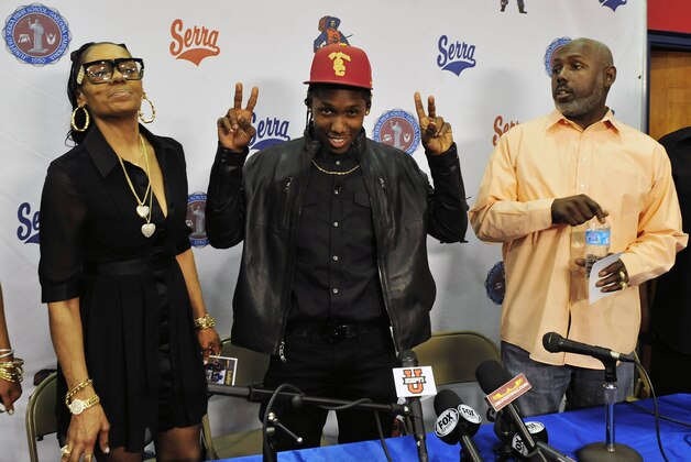 Feb 5, 2014; Gardena, CA, USA; Junipero Serra high school cornerback Adoree Jackson with his parents after he signs with the University of Southern California during national signing day at Junipero Serra High School. Mandatory Credit: Gary A. Vasquez-USA TODAY Sports Feb 5, 2014; Gardena, CA, USA; Junipero Serra high school cornerback Adoree Jackson with his parents after he signs with the University of Southern California during national signing day at Junipero Serra High School. Mandatory Credit: Gary A. Vasquez-USA TODAY Sports