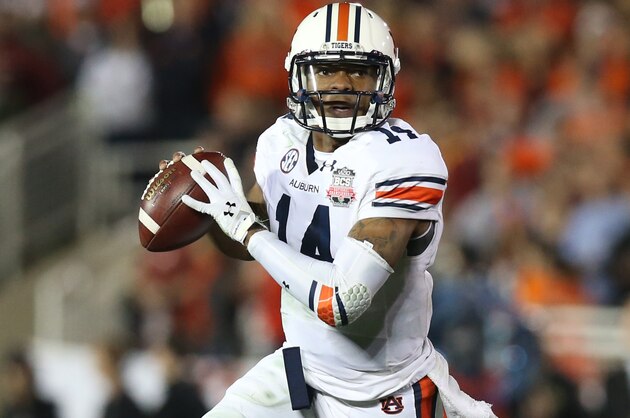 Jan 6, 2014; Pasadena, CA, USA; Auburn Tigers quarterback Nick Marshall (14) scrambles against the Florida State Seminoles during the first half of the 2014 BCS National Championship game at the Rose Bowl. Mandatory Credit: Matthew Emmons-USA TODAY Sports