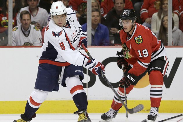 Washington Capitals right wing Alex Ovechkin (8) takes a shot past Chicago Blackhawks center Jonathan Toews (19) during the first period of an NHL hockey game Tuesday, Oct. 1, 2013, in Chicago. (AP Photo/Nam Y. Huh) Washington Capitals right wing Alex Ovechkin (8) takes a shot past Chicago Blackhawks center Jonathan Toews (19) during the first period of an NHL hockey game Tuesday, Oct. 1, 2013, in Chicago. (AP Photo/Nam Y. Huh)