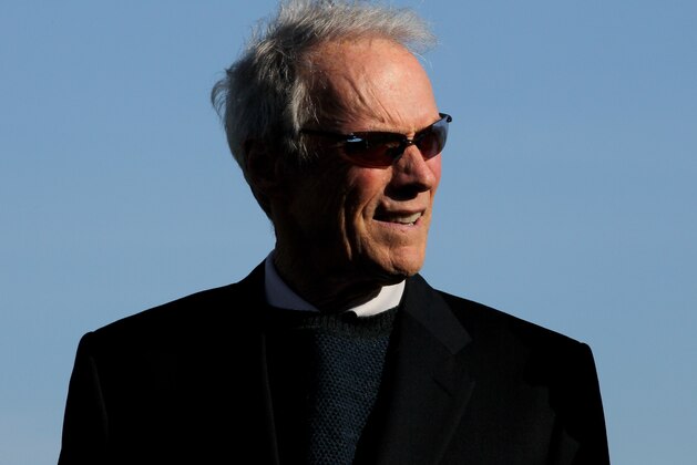 PEBBLE BEACH, CA - FEBRUARY 14:  Clint Eastwood waits on the 18th green to present the trophy during the final round of the AT&T Pebble Beach National Pro-Am at Pebble Beach Golf Links on February 14, 2010 in Pebble Beach, California.  (Photo by Stephen Dunn/Getty Images)