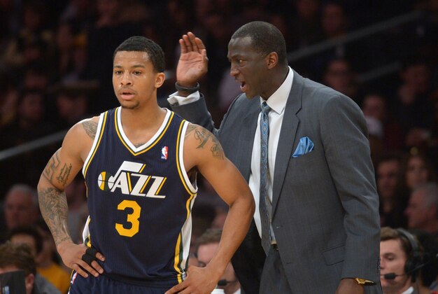 Jan 3, 2014; Los Angeles, CA, USA; Utah Jazz guard Trey Burke (3) and coach Tyrone Corbin during the game against the Los Angeles Lakers at Staples Center. The Lakers defeated the Jazz 110-99. Mandatory Credit: Kirby Lee-USA TODAY Sports