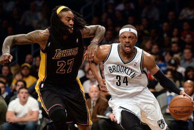 Nov 27, 2013; Brooklyn, NY, USA; Los Angeles Lakers center Jordan Hill (27) guards Brooklyn Nets small forward Paul Pierce (34) during the second half at Barclays Center. The Lakers won 99-94. Mandatory Credit: Joe Camporeale-USA TODAY Sports