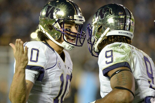 PASADENA, CA - NOVEMBER 15:  Cyler Miles #10 of the Washington Huskies celebrates a Damore'ea Stringfellow #9 touchdown during the fourth quarter at Rose Bowl on November 15, 2013 in Pasadena, California.  (Photo by Harry How/Getty Images)