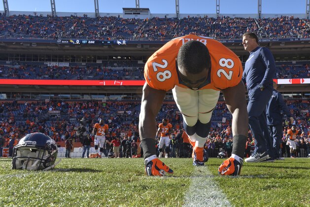 Denver Broncos running back Montee Ball (28) stretches before playing against the San Diego Chargers in an NFL AFC division playoff football game, Sunday, Jan. 12, 2014, in Denver. (AP Photo/Jack Dempsey)