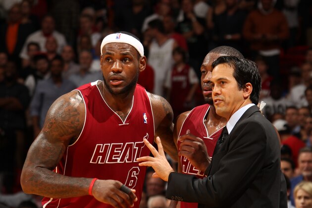 MIAMI, FL - DECEMBER 18: Erik Spoelstra of the Miami Heat shares a word with LeBron James #6 during the game the game against the Indiana Pacers on December 18, 2013 at American Airlines Arena in Miami, Florida. NOTE TO USER: User expressly acknowledges and agrees that, by downloading and/or using this photograph, user is consenting to the terms and conditions of the Getty Images License Agreement. Mandatory copyright notice: Copyright NBAE 2013 (Photo by Issac Baldizon/NBAE via Getty Images)