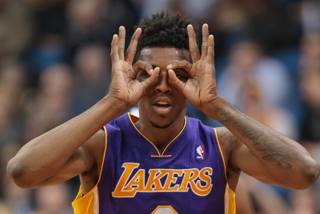 Feb 4, 2014; Minneapolis, MN, USA; Los Angeles Lakers forward Nick Young (0) celebrates his three pointer in the fourth quarter against the Minnesota Timberwolves at Target Center. Minnesota wins 109-99. Mandatory Credit: Brad Rempel-USA TODAY Sports Feb 4, 2014; Minneapolis, MN, USA; Los Angeles Lakers forward Nick Young (0) celebrates his three pointer in the fourth quarter against the Minnesota Timberwolves at Target Center. Minnesota wins 109-99. Mandatory Credit: Brad Rempel-USA TODAY Sports