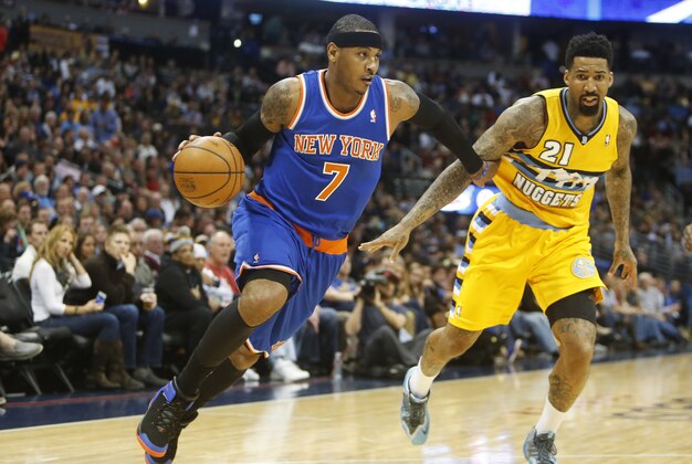 Nov 29, 2013; Denver, CO, USA; New York Knicks forward Carmelo Anthony (7) drives to the basket past Denver Nuggets forward Wilson Chandler (21) during the first half at Pepsi Center. Mandatory Credit: Chris Humphreys-USA TODAY Sports