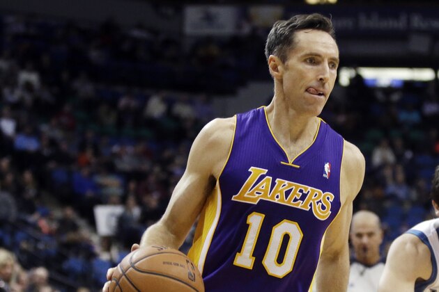 Los Angeles Lakers' Steve Nash drives  the ball in an NBA basketball game against the Minnesota Timberwolves, Tuesday, Feb. 4, 2014, in Minneapolis. It was the first game back for Nash since early November as he recovered from a back injury. (AP Photo/Jim Mone)