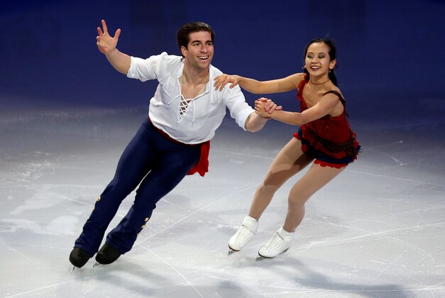 Jan 12, 2014; Boston, MA, USA; Felicia Zhang and Nathan Bartholomay skate during the skating spectacular exhibition event in the U.S. Figure Skating Championships at TD Garden. Mandatory Credit: Greg M. Cooper-USA TODAY Sports