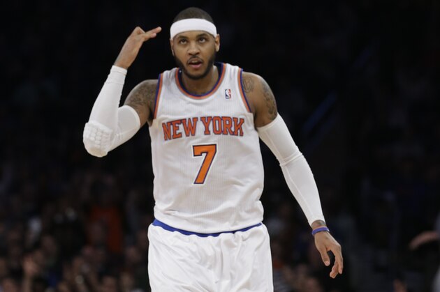 New York Knicks' Carmelo Anthony gestures after making a 3-point basket during the first half of an NBA basketball game against the Denver Nuggets on Friday, Feb. 7, 2014, in New York. The Knicks won 117-90. (AP Photo/Frank Franklin II)