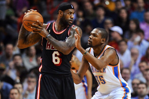 Jan 29, 2014; Miami, FL, USA; Miami Heat small forward LeBron James (6) is pressured by Oklahoma City Thunder small forward Kevin Durant (35) during the first half  at American Airlines Arena. Mandatory Credit: Steve Mitchell-USA TODAY Sports