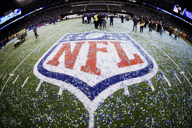 The field and NFL logo are covered with confetti after the NFL Super Bowl XLVIII football game between the Seattle Seahawks and the Denver Broncos Sunday, Feb. 2, 2014, in East Rutherford, N.J. The Seahawks won 43-8. (AP Photo/Mark Humphrey)