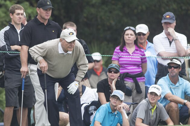 Gary Nicklaus looks over his fathers Jack Nicklaus's shoulder on the 10th hole during the Father-Son Challenge at the Ritz-Carlton Golf Club in Orlando, Fla., Sunday, Dec. 15, 2013. (AP Photo/Willie J. Allen Jr.)