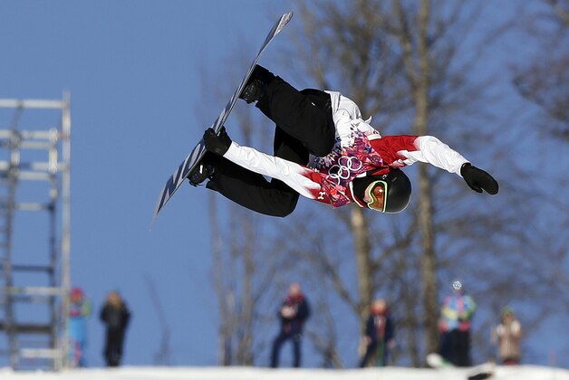 Canada's Mark McMorris takes a jump during the men's  snowboard slopestyle semifinal at the Rosa Khutor Extreme Park, at the 2014 Winter Olympics, Saturday, Feb. 8, 2014, in Krasnaya Polyana, Russia. (AP Photo/Andy Wong)