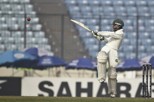 Bangladesh's Mominul Haque plays a shot  on the fourth day of their first test cricket match against Sri Lanka in Dhaka, Bangladesh, Thursday, Jan. 30, 2014. (AP Photo/A.M. Ahad)