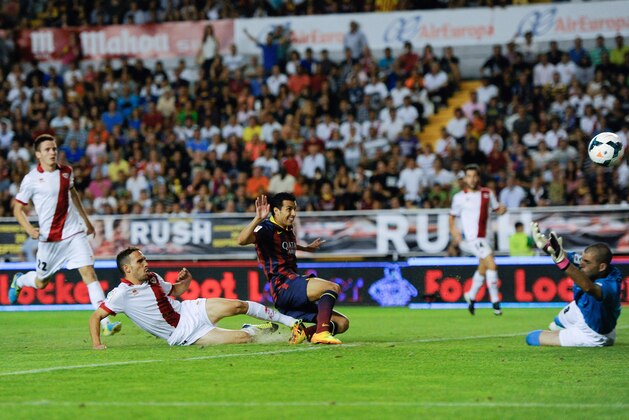 MADRID, SPAIN - SEPTEMBER 21:  Pedro Rodriguez of FC Barcelona scores his team's second goal during the La Liga match between Rayo Vallecano de Madrid and FC Barcelona at Estadio Teresa Rivero on September 21, 2013 in Madrid, Spain.  (Photo by David Ramos/Getty Images)