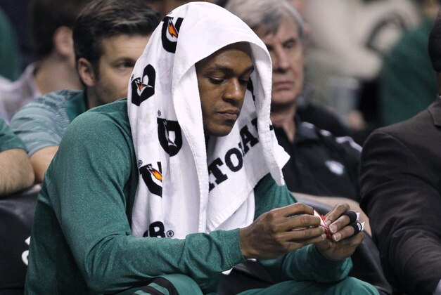 Boston Celtics guard Rajon Rondo sits on the bench during the second half of an NBA basketball game against the Oklahoma City Thunder in Boston, Friday, Jan. 24, 2014. Rondo was held to five points as the Thunder defeated the Celtics 101-83. (AP Photo/Charles Krupa)