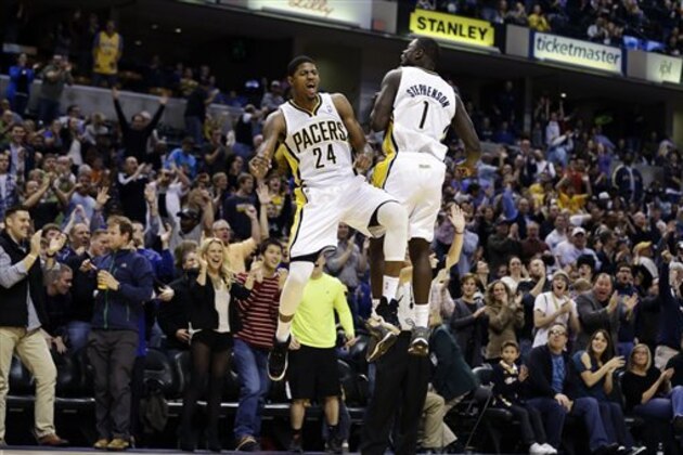 Indiana Pacers' Paul George (24) and Lance Stephenson celebrate after George hit a 3-pointer during the second half of an NBA basketball game against the New Orleans Hornets, Wednesday, Nov. 21, 2012, in Indianapolis. The Pacers won 115-107 in overtime. (AP Photo/Darron Cummings)