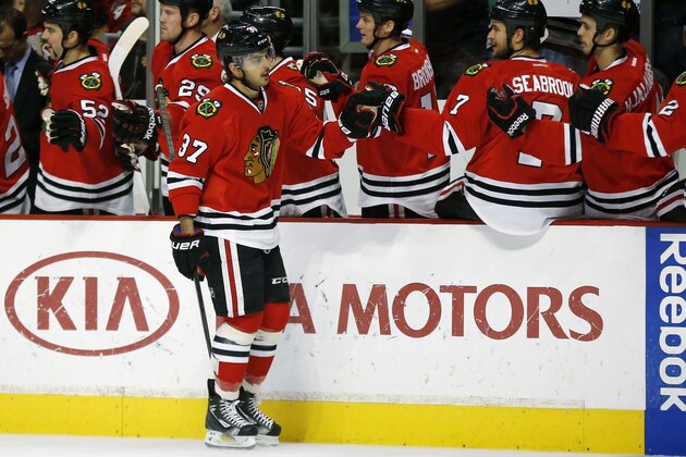 Chicago Blackhawks center Brandon Pirri (37) celebrates scoring a goal against the San Jose Sharks during the first period of an NHL hockey game on Sunday, Nov. 17, 2013, in Chicago. (AP Photo/Andrew A. Nelles)