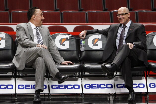 Chicago Bulls general manager Gar Forman, left, and executive vice president of basketball operations John Paxson talk before an NBA basketball game between the Bulls and the Cleveland Cavaliers, Tuesday, Feb. 26, 2013, in Chicago. (AP Photo/Charles Cherney)