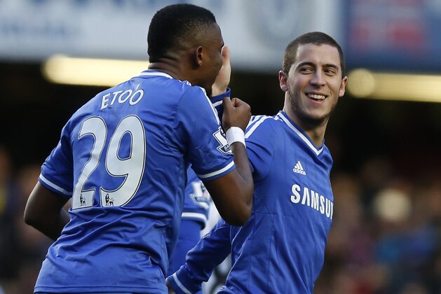 Chelsea's Eden Hazard, right, celebrates his penalty goal against Newcastle United with teammate Samuel Eto'o during their English Premier League soccer match at Stamford Bridge, London, Saturday, Feb. 8, 2014. (AP Photo/Sang Tan)