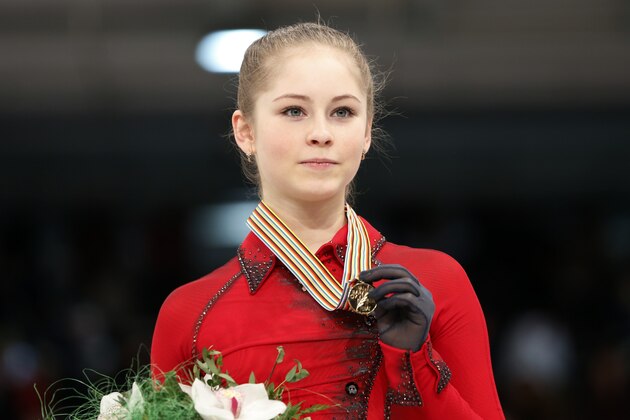 Russia's Julia Lipnitskaia celebrates her gold medal following the women's free skating at the European Figure Skating Championships in Budapest, Hungary, Friday, Jan. 17, 2014. (AP Photo/Darko Bandic)