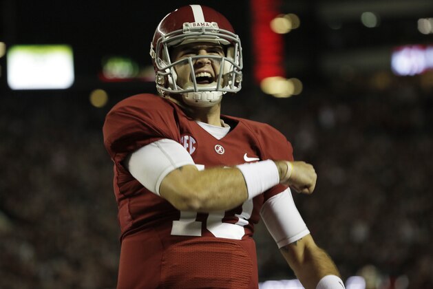 Alabama quarterback AJ McCarron (10) celebrates a touch down scored by Alabama tight end O.J. Howard (88) during the first half of an NCAA college football game against LSU , Saturday, Nov. 9, 2013, in Tuscaloosa, Ala. (AP Photo/Dave Martin)