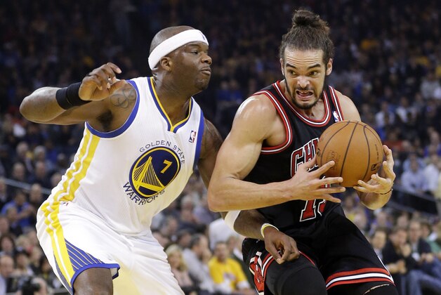 Chicago Bulls' Joakim Noah (13) dribbles next to Golden State Warriors' Jermaine O'Neal (7) during the first half of an NBA basketball game on Thursday, Feb. 6, 2014, in Oakland, Calif. (AP Photo/Marcio Jose Sanchez)