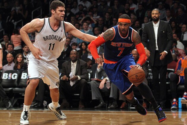 Dec 5, 2013; Brooklyn, NY, USA; New York Knicks small forward Carmelo Anthony (7) drives on Brooklyn Nets center Brook Lopez (11) during the second quarter of a game at Barclays Center. Mandatory Credit: Brad Penner-USA TODAY Sports