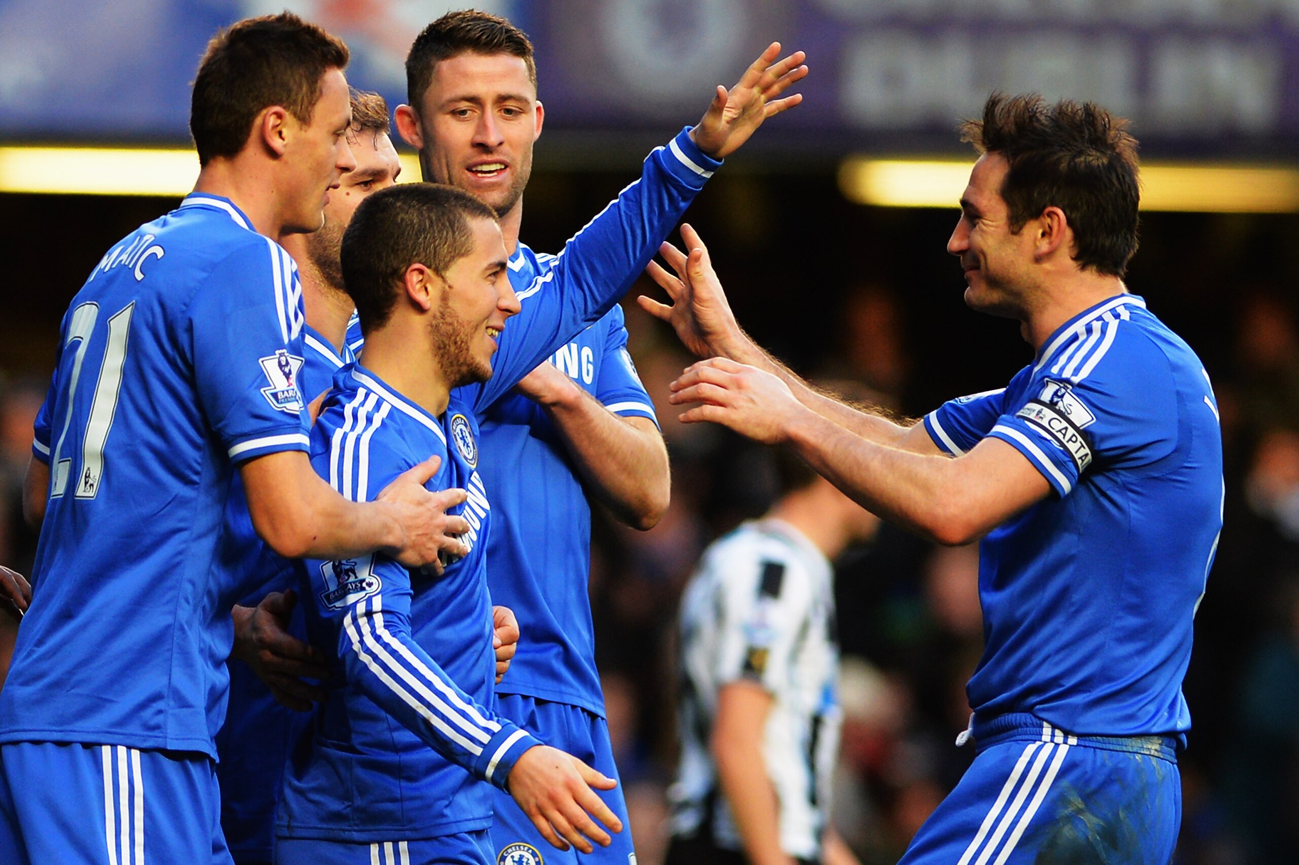 LONDON, ENGLAND - FEBRUARY 08:  Eden Hazard (2nd left) of Chelsea is congratulated by team mates including Frank Lampard (right) after scoring his third goal from the penalty spot during the Barclays Premier League match between Cheslea and Newcastle United at Stamford Bridge on February 8, 2014 in London, England.  (Photo by Shaun Botterill/Getty Images)