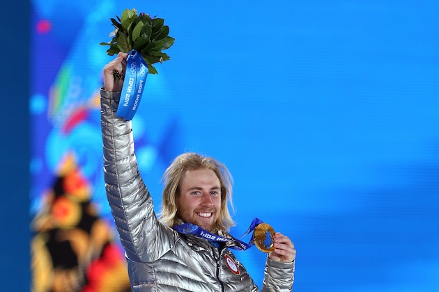 SOCHI, RUSSIA - FEBRUARY 08:  Gold medalist Sage Kotsenburg of the United States celebrates during the medal ceremony for the Snowboard Men's Slopestyle  during day 1 of the Sochi 2014 Winter Olympics at Medals Plaza on February 8, 2014 in Sochi, Russia.  (Photo by Paul Gilham/Getty Images)